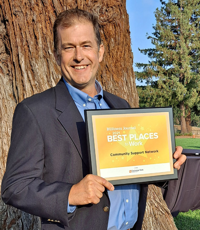 CSN Executive Director Tom Bieri holds the Business Journal Best Places To Work 2021 Award